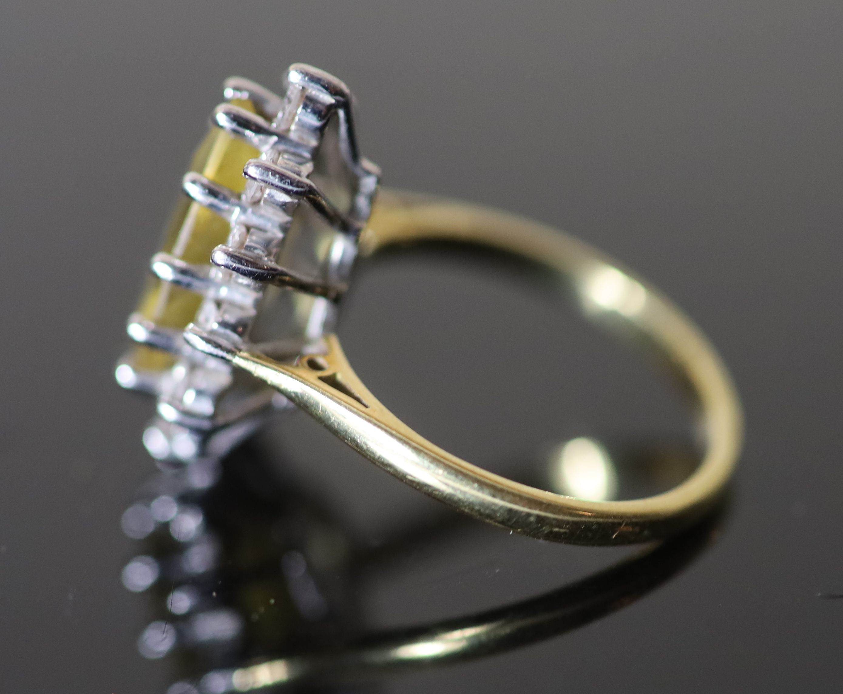 A modern 18ct gold, pear shaped yellow tourmaline and diamond set cluster dress ring,